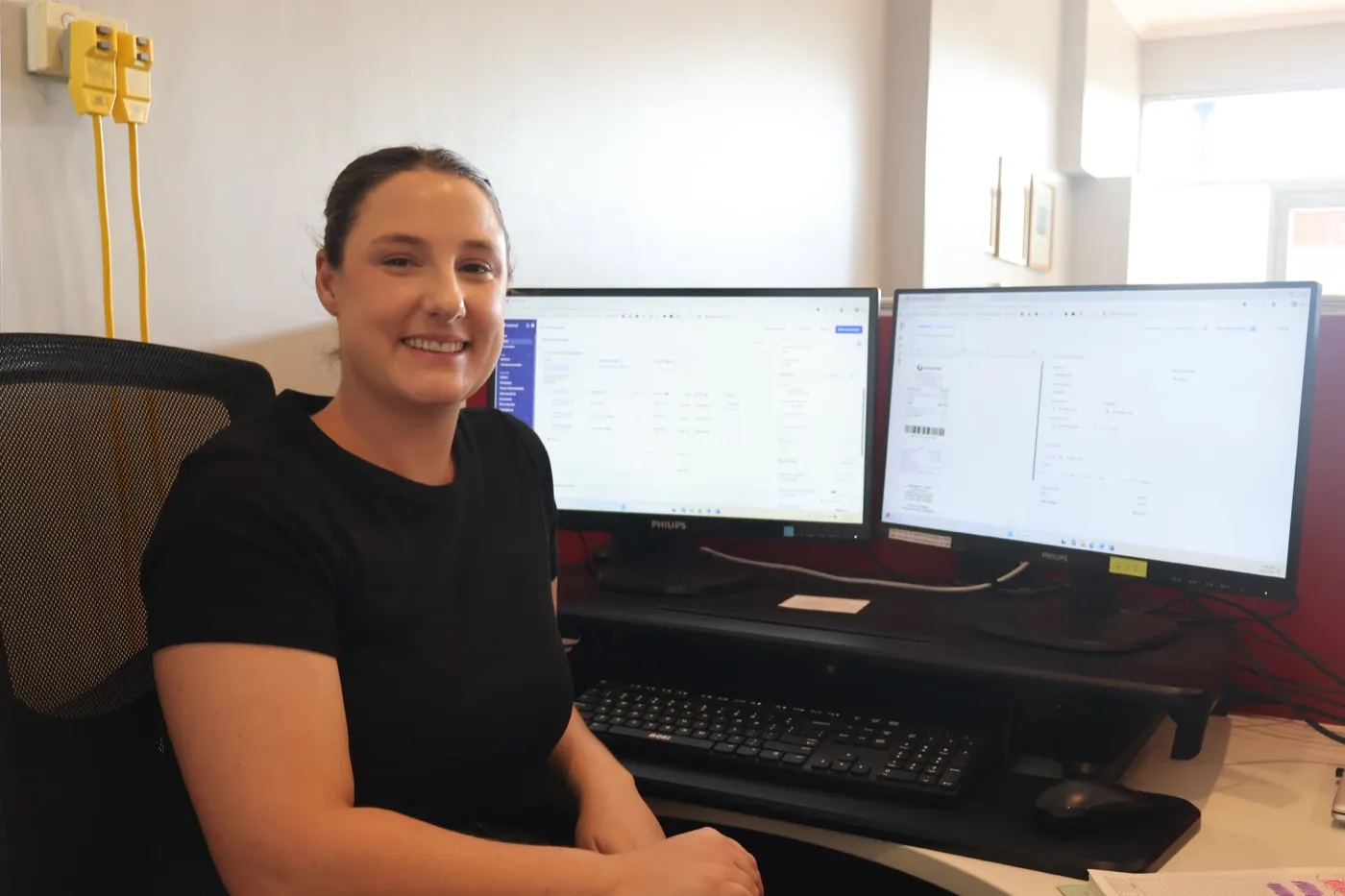 Gemma at her desk using Invoice Harbour